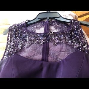A dark plum floor length prom dress
